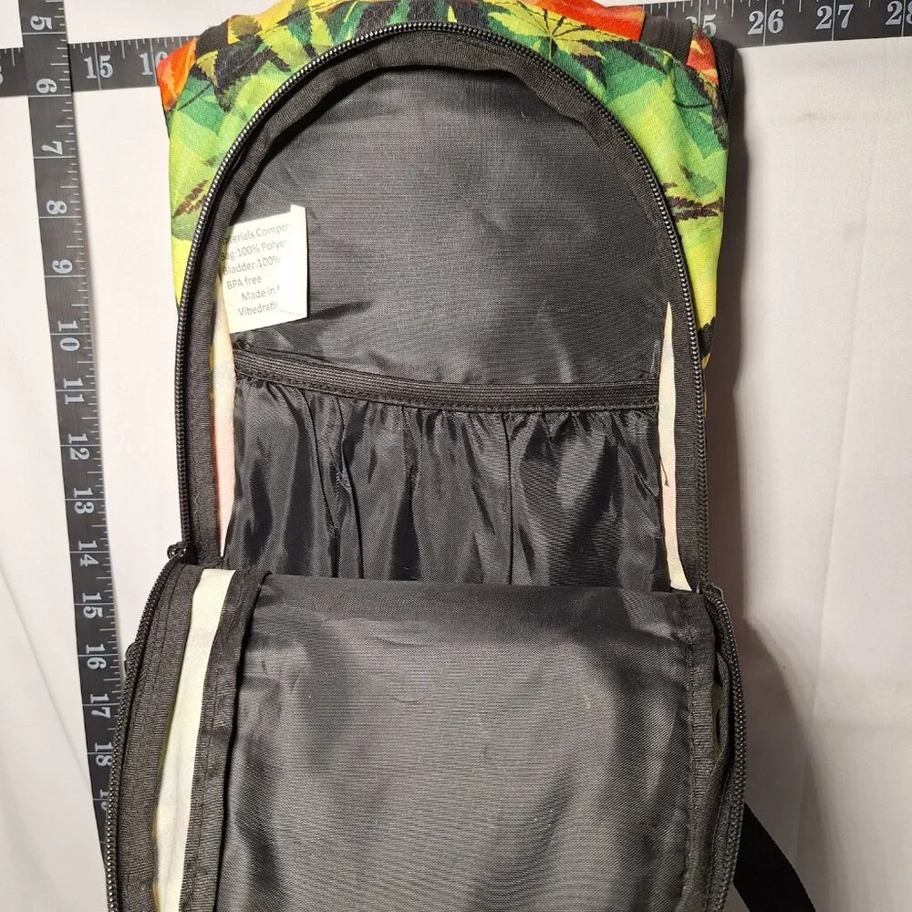 Vibedration Hydration Backpack w/o bladder - green, orange, black leaves - used